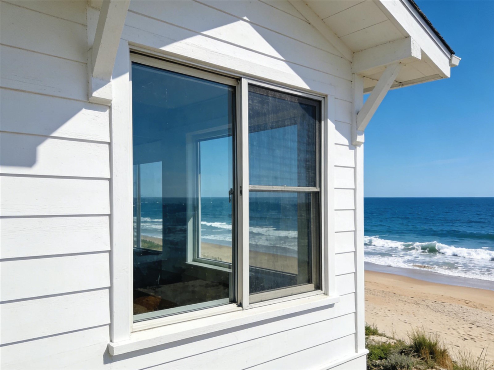 Hurricane impact sliding doors installed in a coastal home exposed to high-wind conditions Hurricane impact sliding doors installed in a coastal home exposed to high-wind conditions